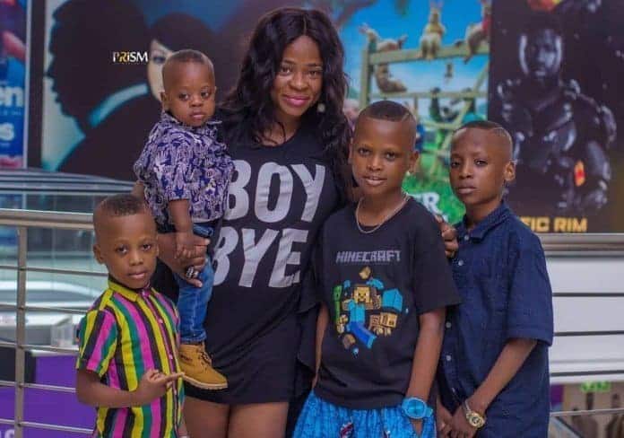 kunle afod's wife and their boys in a 2018 family picture