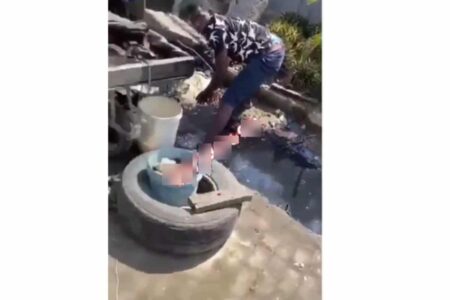 Aboki caught washing fruit inside gutter