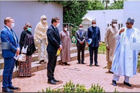 Buhari and E.U representatives practicing social distancing