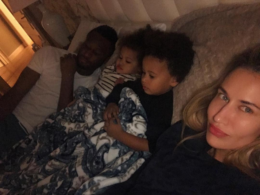 Mikel Obi and his family on the bed