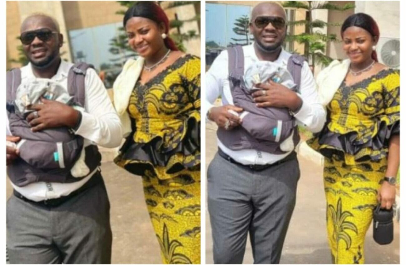 Yomi Fabiyi carries his son on baby carrier