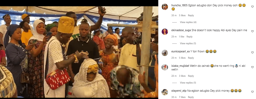 Panic as Portable's wife looks miserable at baby's naming ceremony (video)