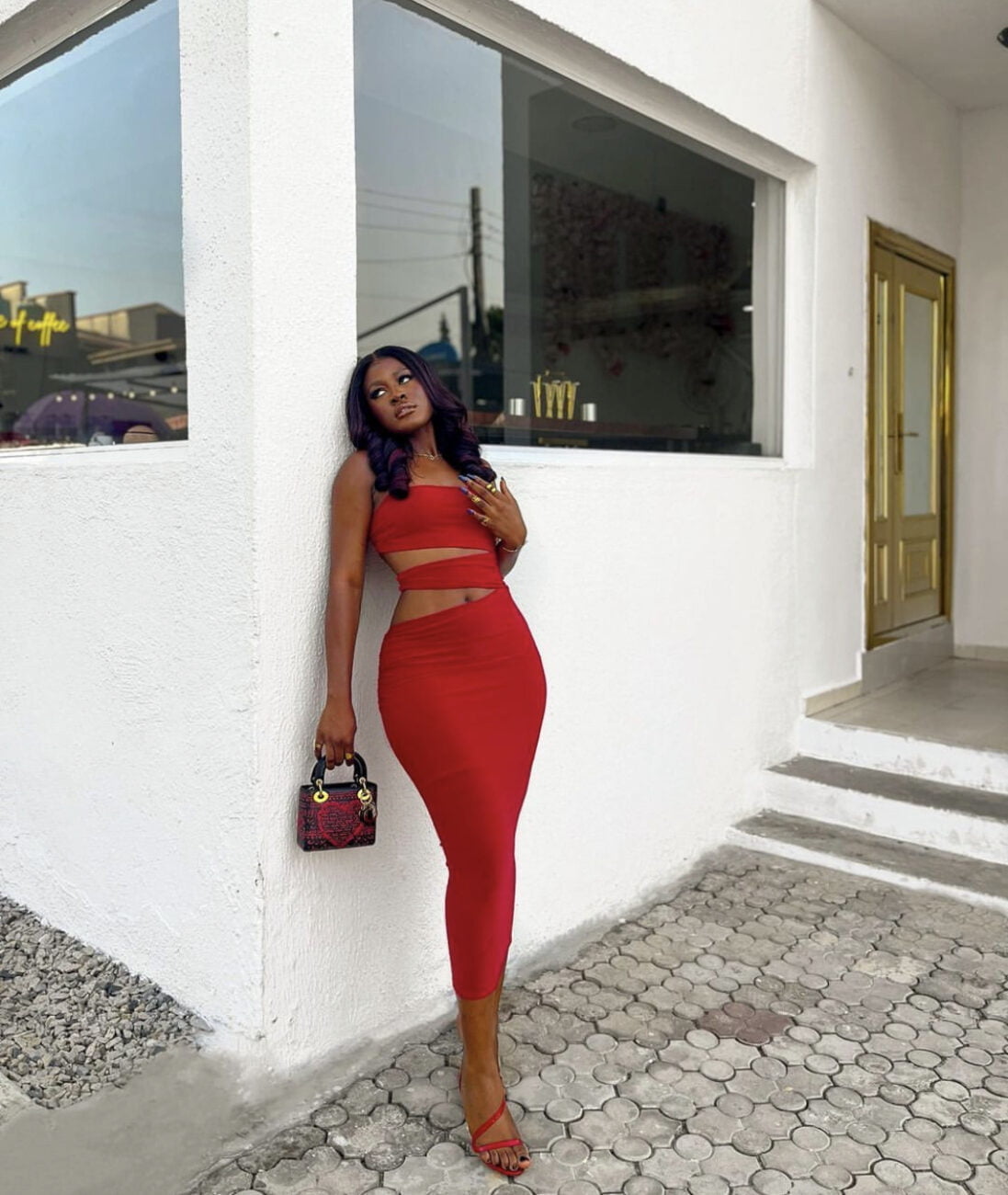 Lady in red: Alex Unusual slays in a red dress.