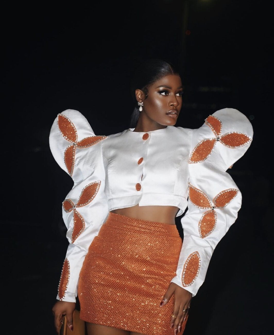 High fashion moment: Alex Unusual in a bold high shouldered and puffy sleeve outfit.