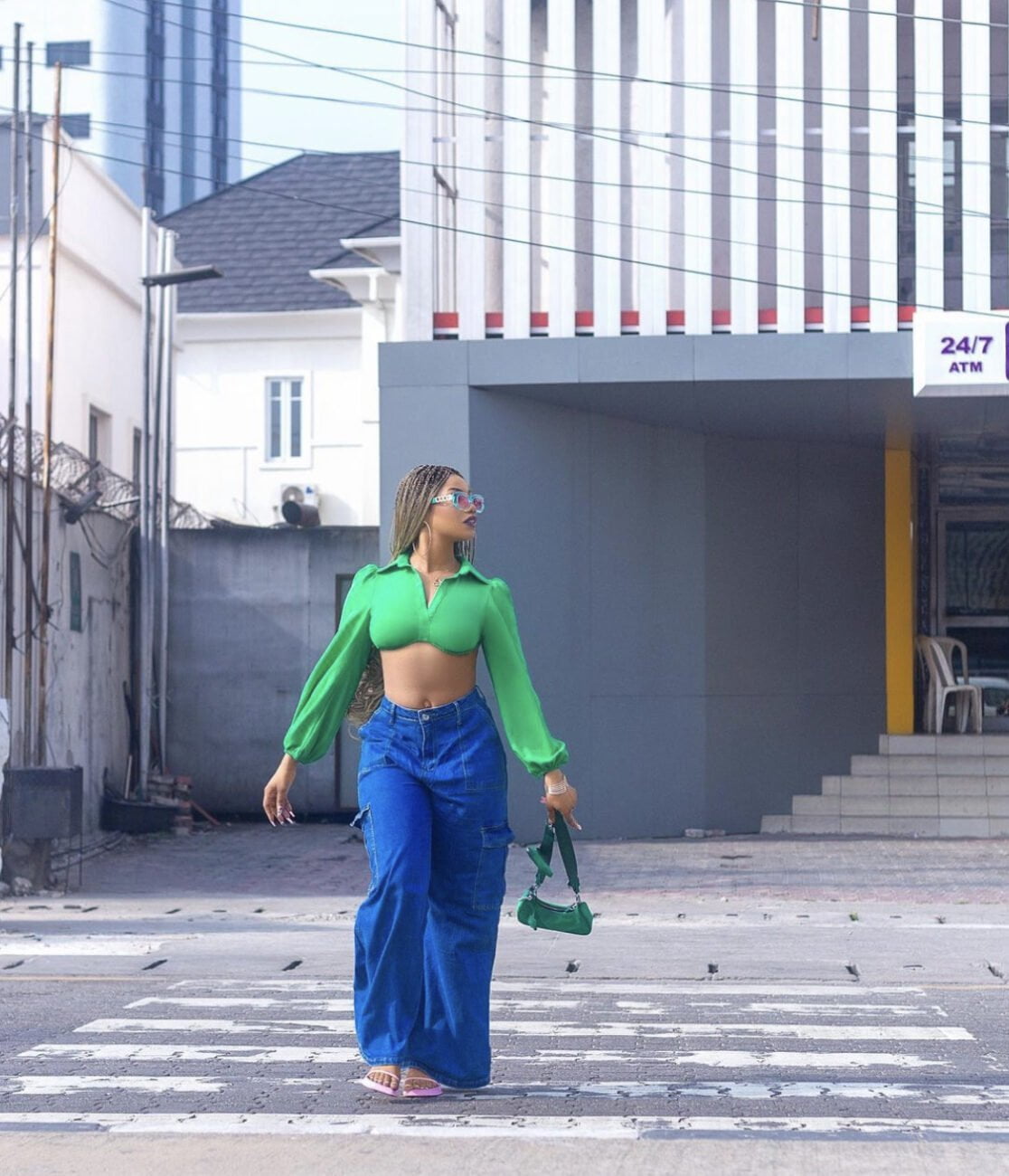 Tacha brings swag to street fashion with blue baggy jeans and a crop top.