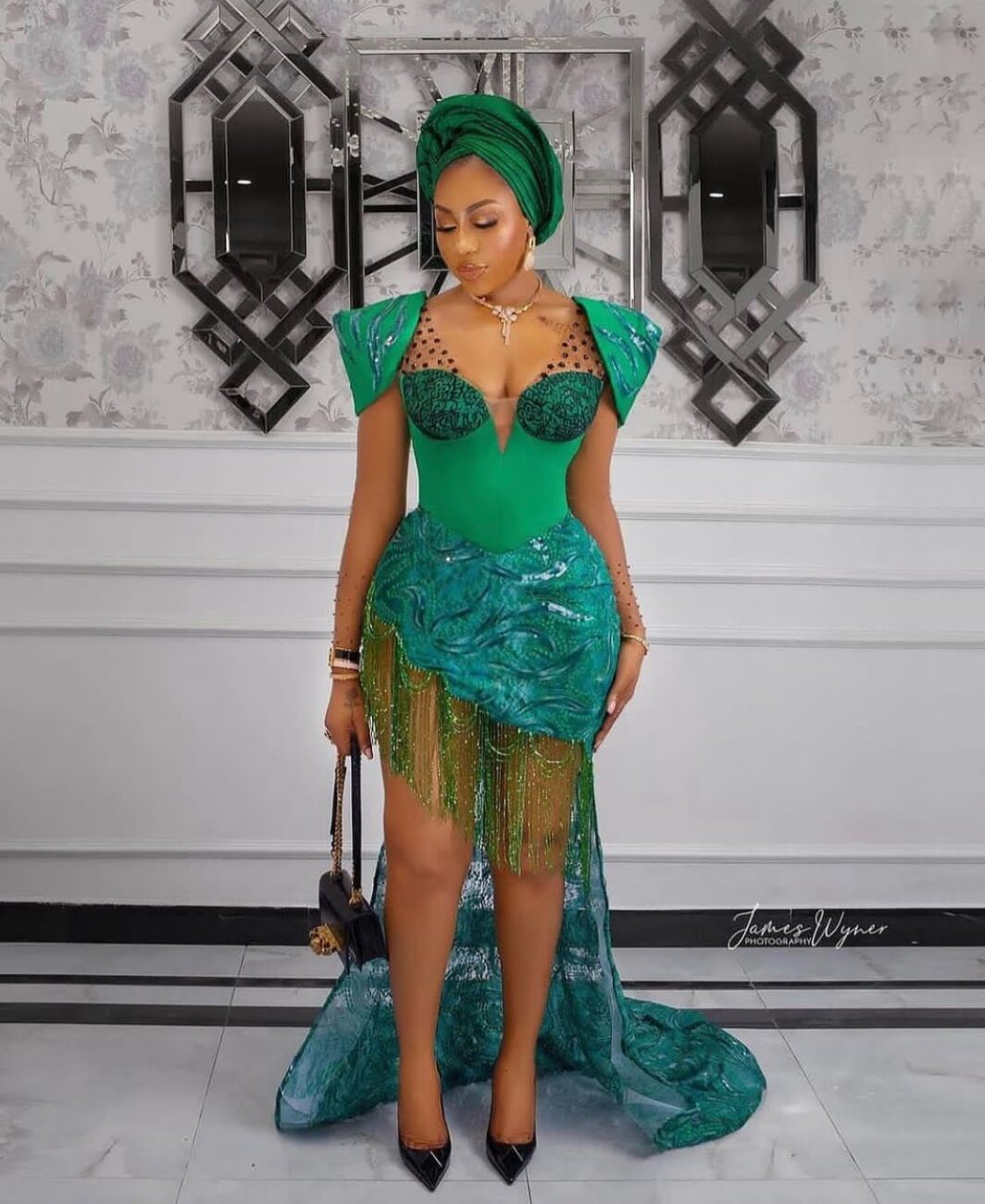 Gorgeous green Aseobi lace dress with a cape.