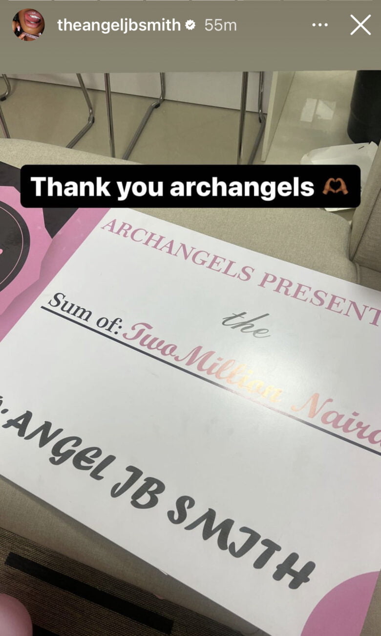 Angel shows off 2 million naira cheque from fans.