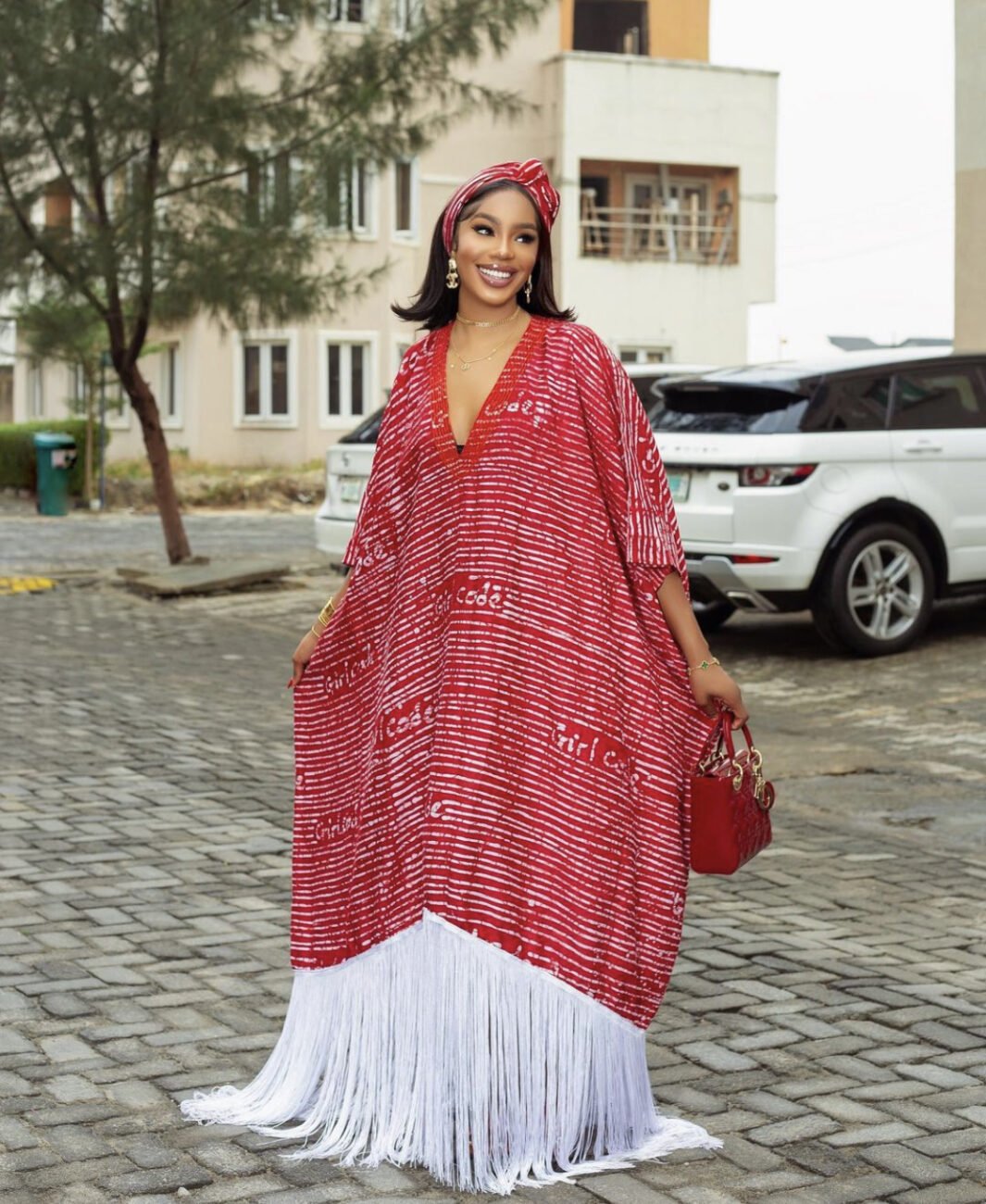 Sharon Ooja in a red and white Bubu dress.