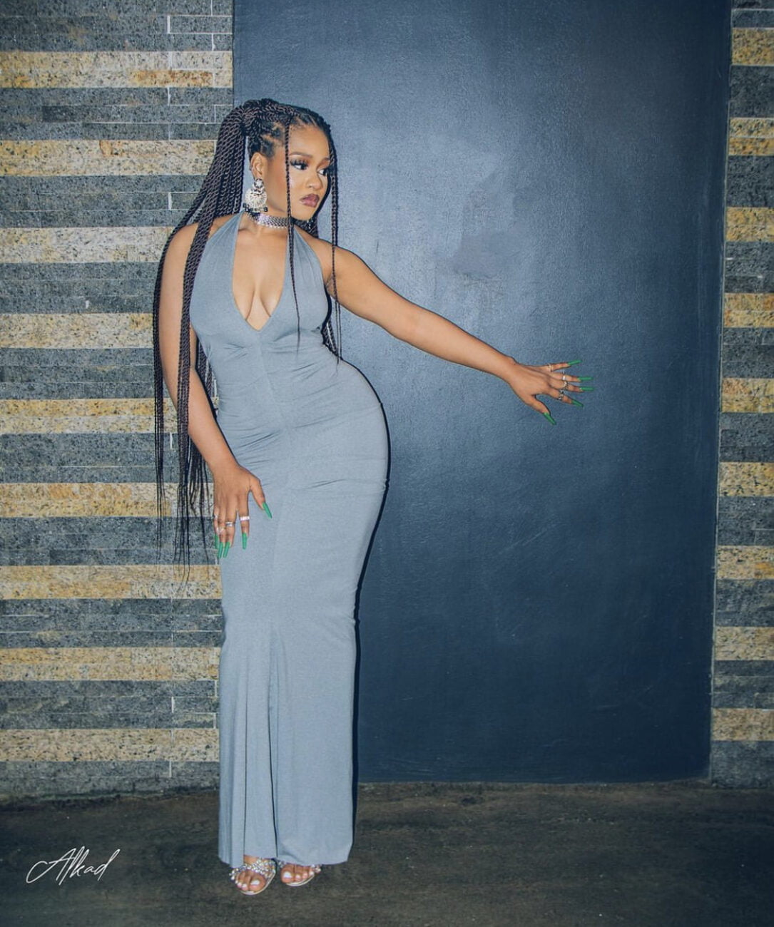 Phyna in a grey colored body con dress.