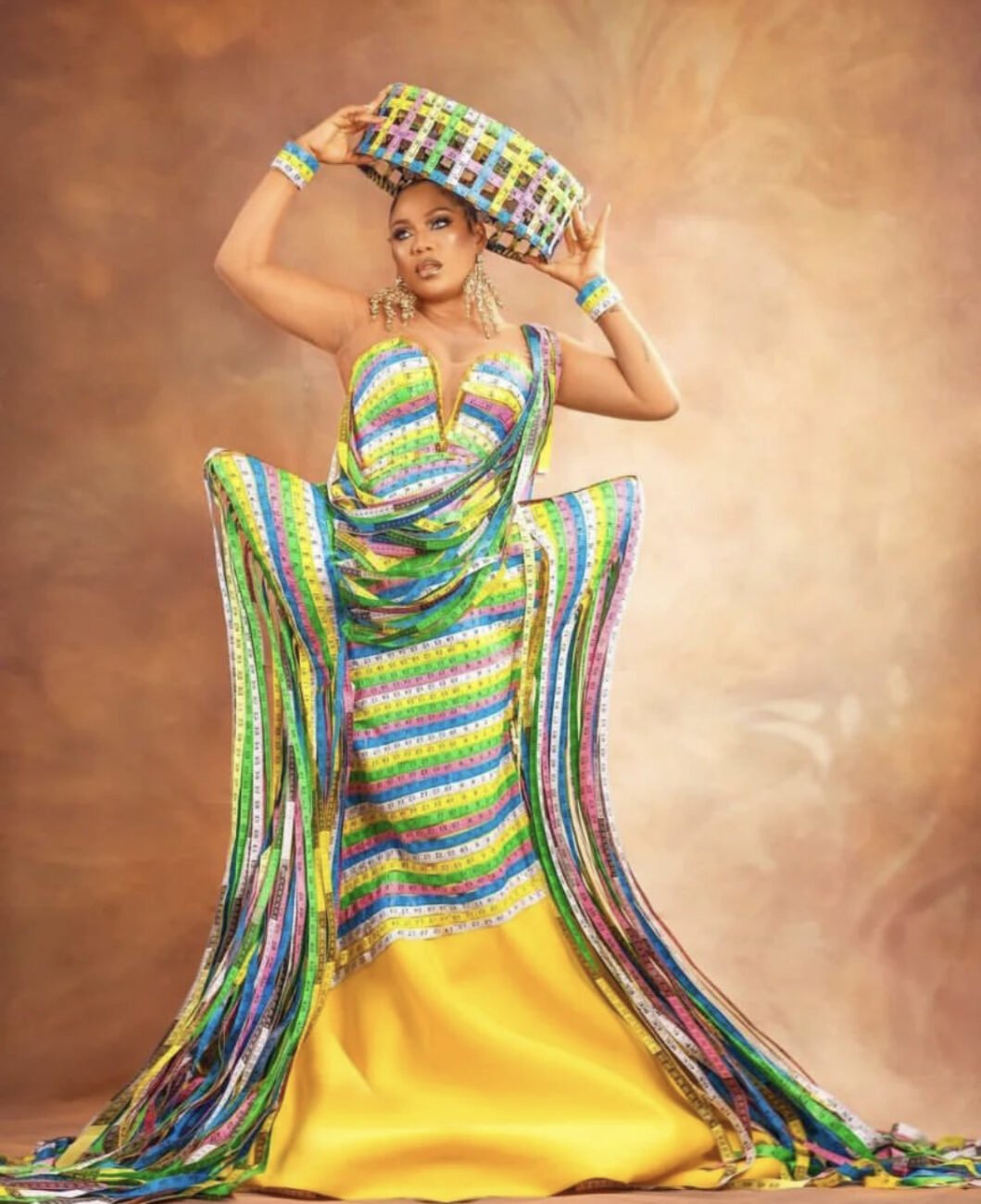 Toyin Lawani in a dress made out of tailor’s measuring tape.