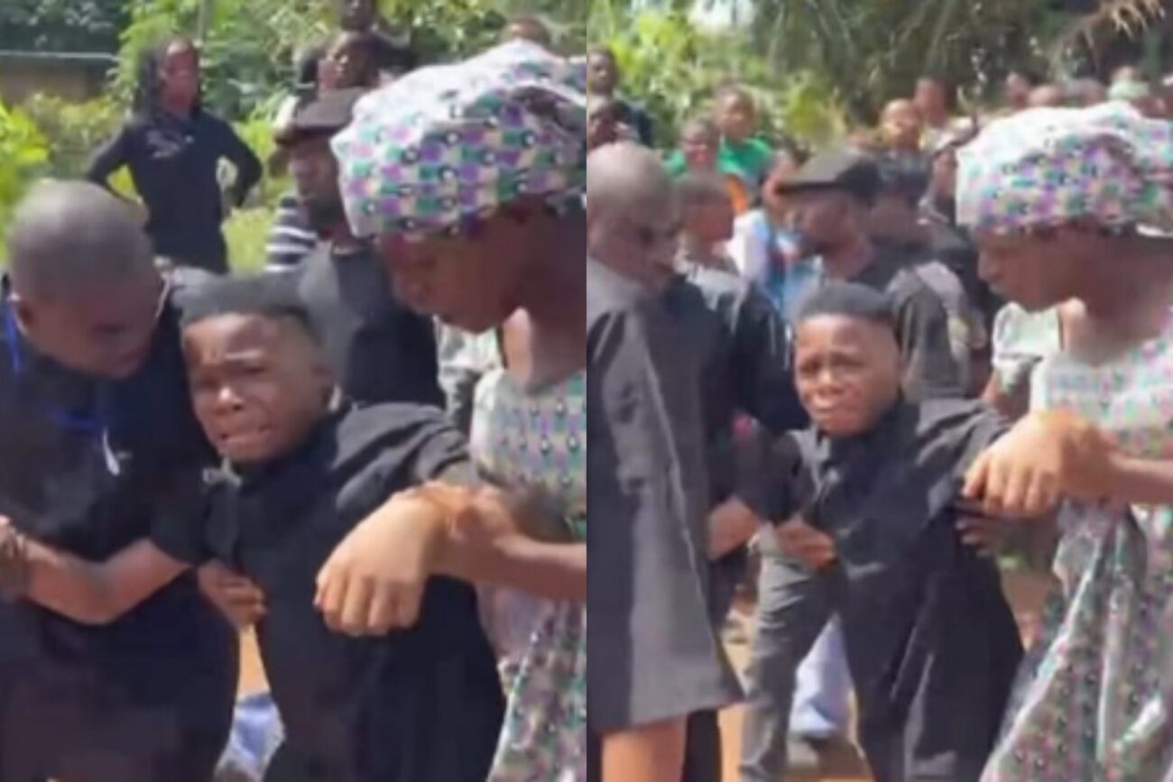 Junior Pope's son weeps at his funeral